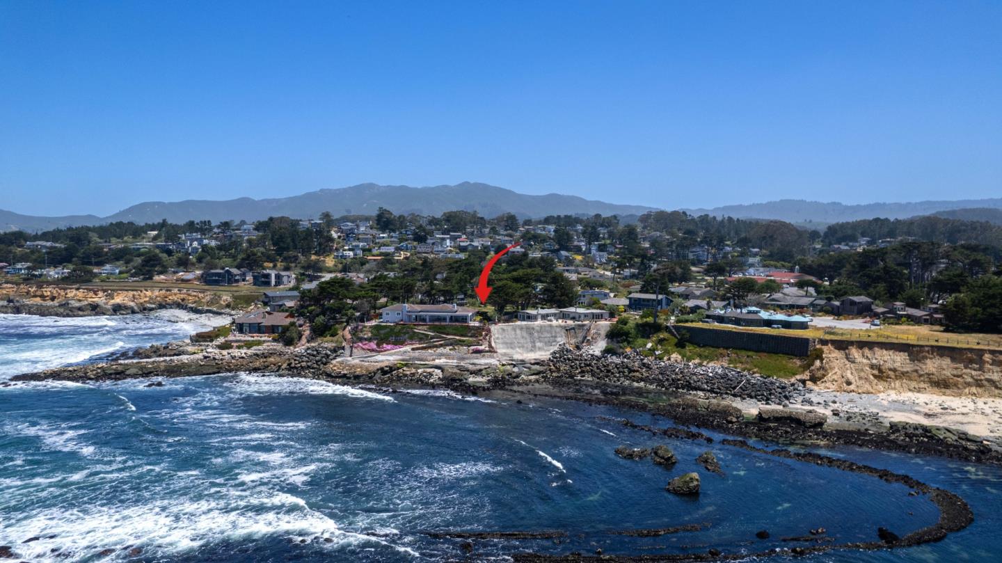 155 Reef Point Road Moss Beach, CA 94038 - Photo 16 of 16 a view of a lake with a mountain