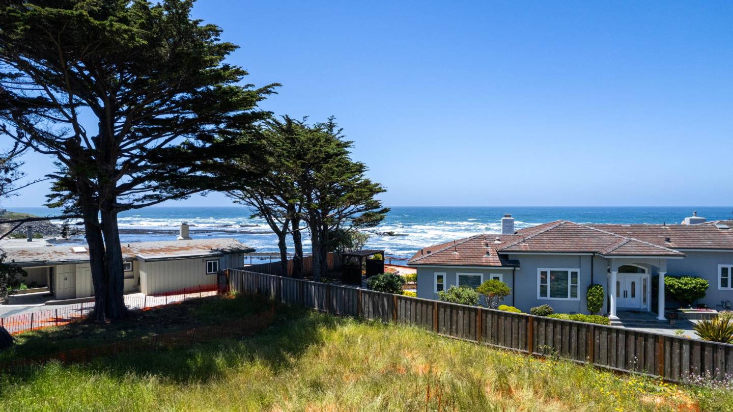 155 Reef Point Road Moss Beach, CA 94038 - Photo 7 of 16 a view of a house with pool and chairs