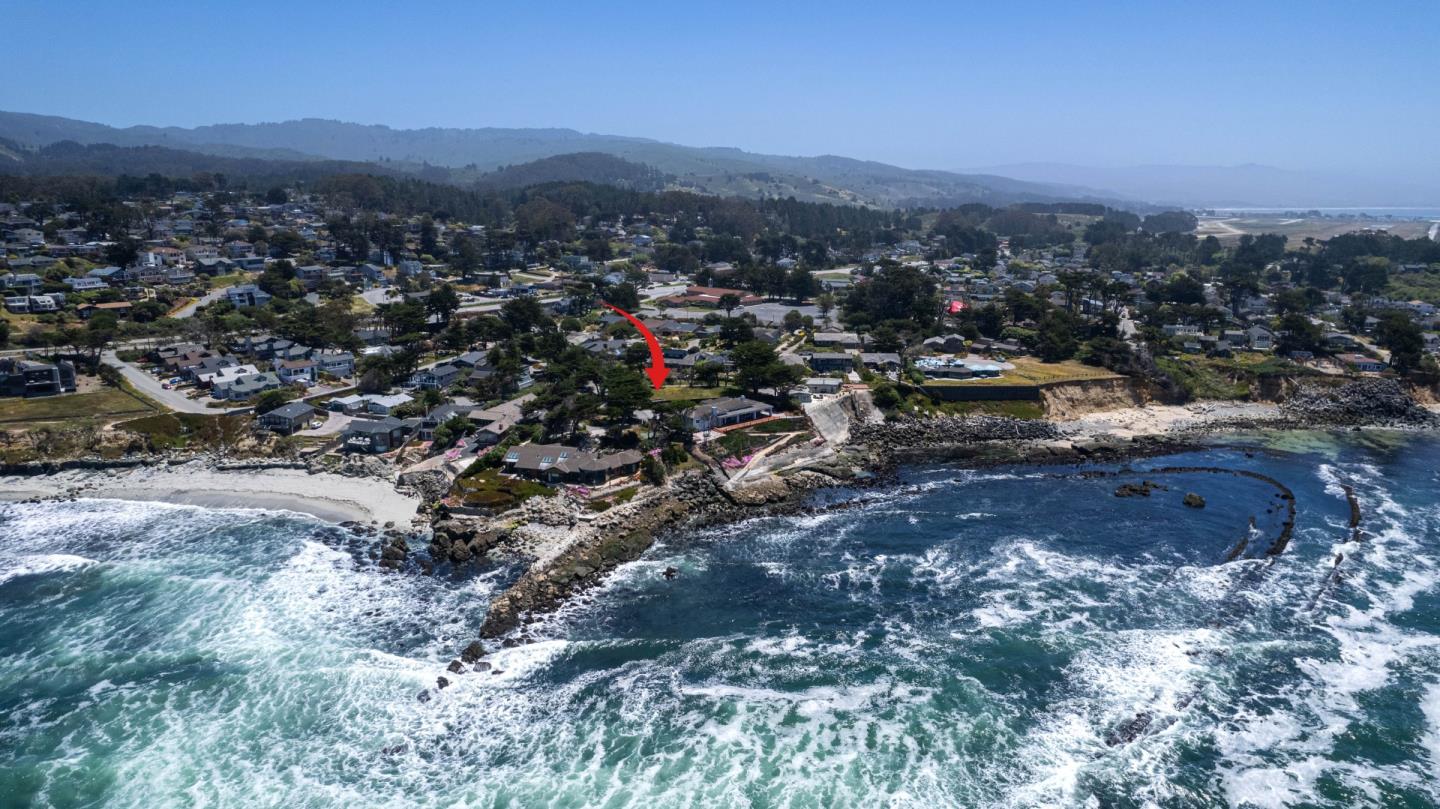 155 Reef Point Road Moss Beach, CA 94038 - Photo 8 of 16 a view of a city with mountains in the background