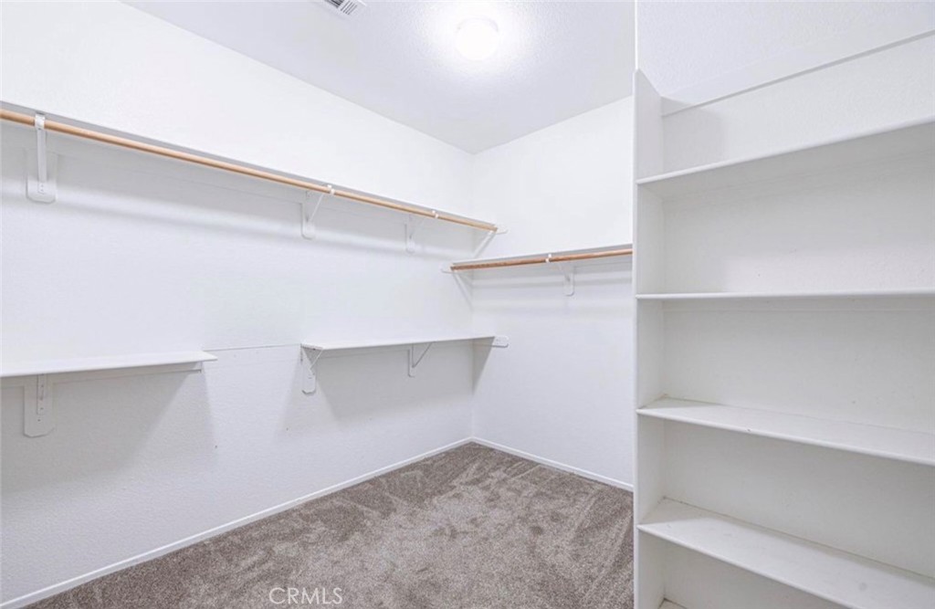 43839 58th Street West Lancaster, CA 93536 - Photo 15 of 18 a view of an empty walk in closet