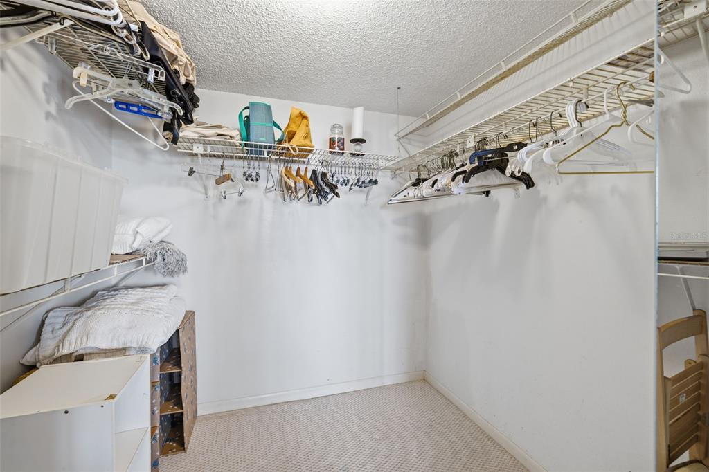 9495 Blind Pass Road, Unit 1208 St. Pete Beach, FL 33706 - Photo 17 of 61 a view of storage and utility room with racks on the wall