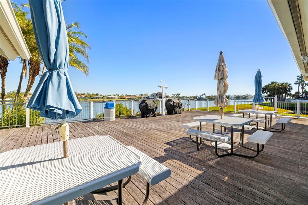 9495 Blind Pass Road, Unit 1208 St. Pete Beach, FL 33706 - Photo 48 of 61 a view of outdoor space with seating