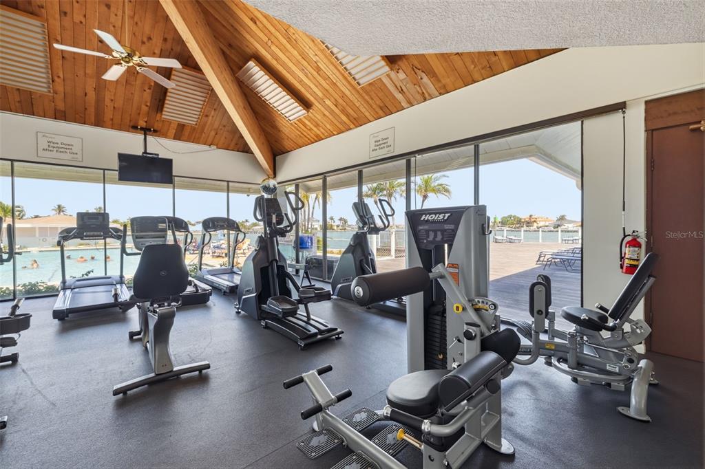 9495 Blind Pass Road, Unit 1208 St. Pete Beach, FL 33706 - Photo 55 of 62 a view of a room with gym equipment