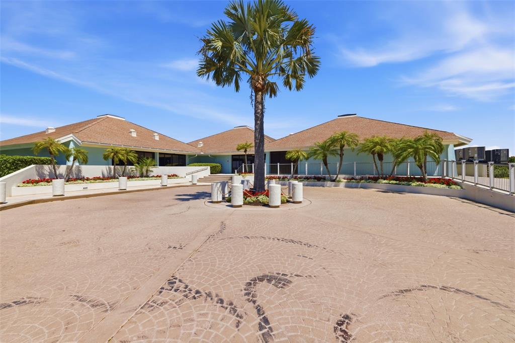 9495 Blind Pass Road, Unit 1208 St. Pete Beach, FL 33706 - Photo 62 of 62 a street view with residential houses and trees