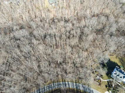 a backyard of a house with a yard covered with snow