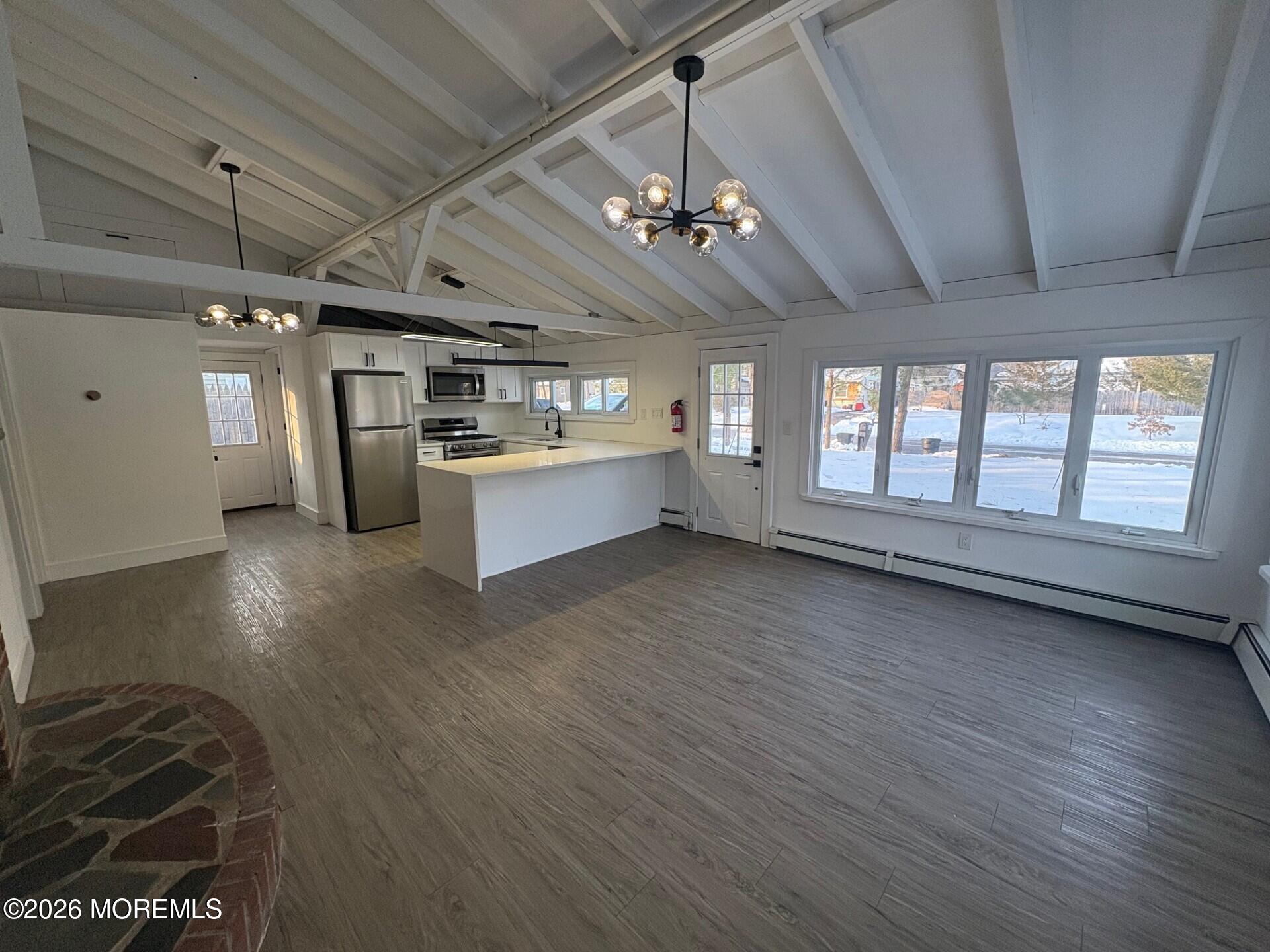 809 Pensacola Road Forked River, NJ 08731 - Photo 2 of 7 a view of a room with stainless steel appliances wooden floors and view living room