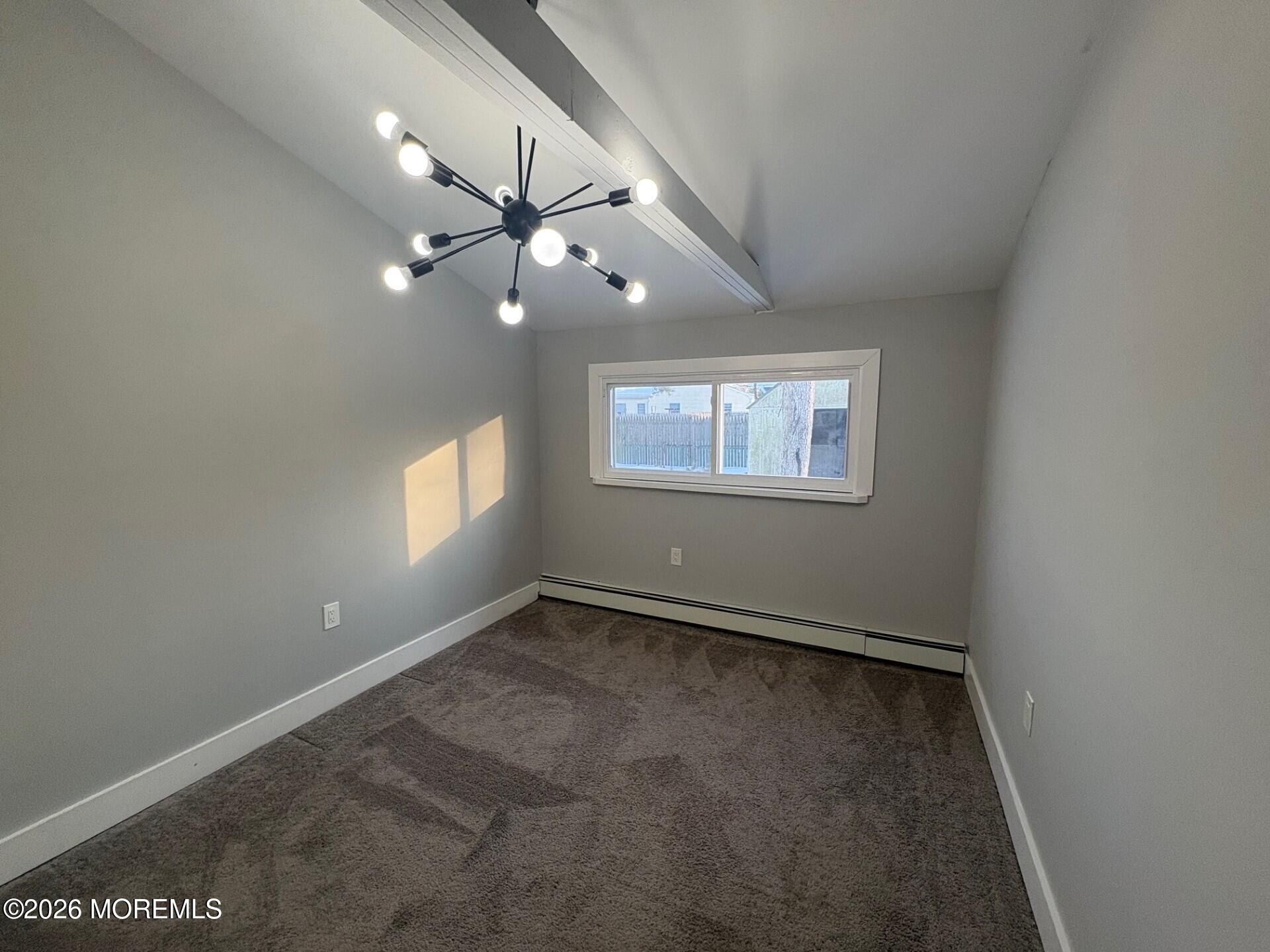 809 Pensacola Road Forked River, NJ 08731 - Photo 5 of 7 an empty room with a window and a fan
