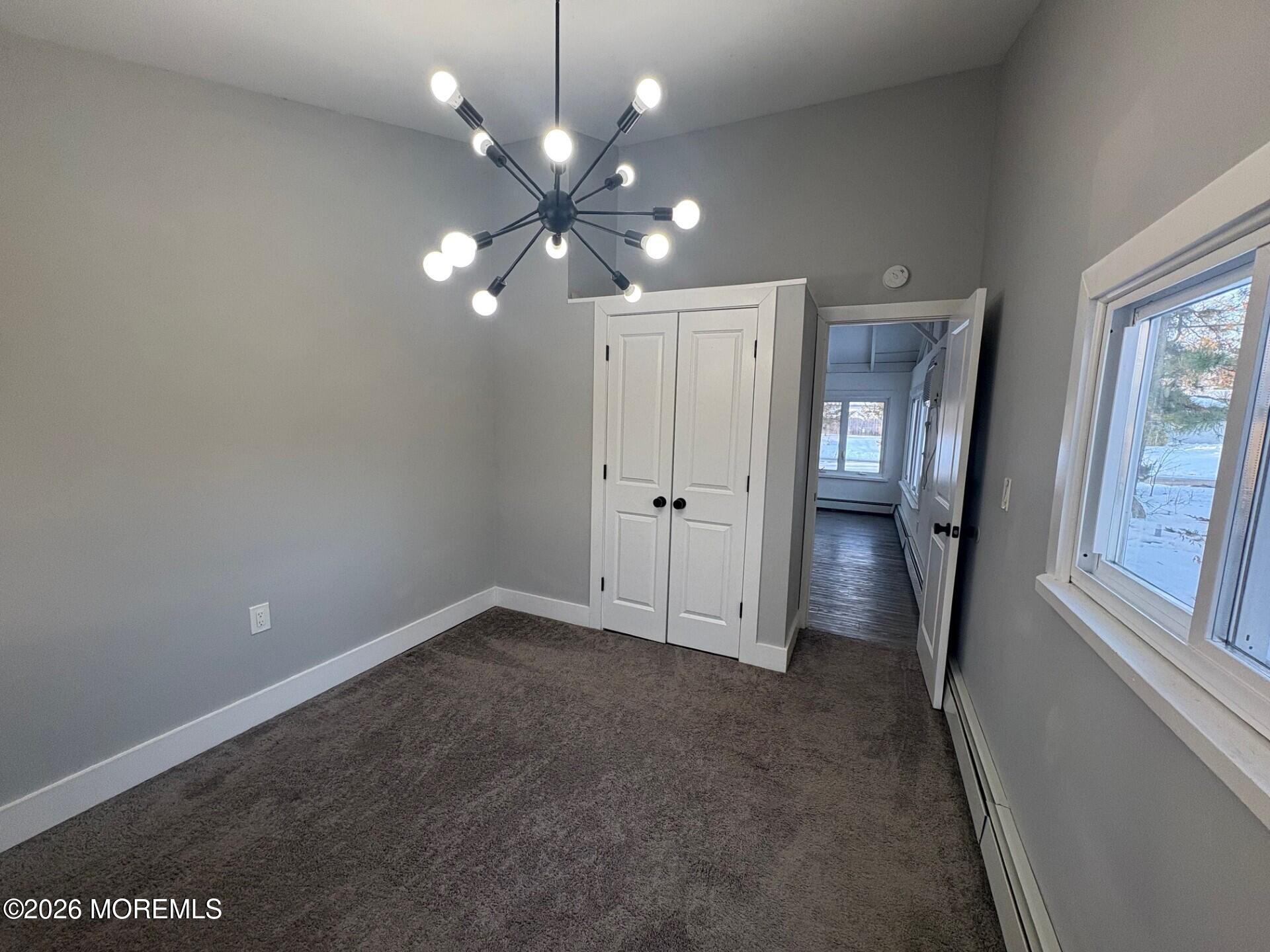 809 Pensacola Road Forked River, NJ 08731 - Photo 7 of 7 wooden floor in an empty room with a mirror