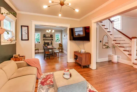 a living room with furniture and a flat screen tv
