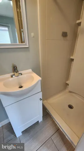 a bathroom with a tub and a sink