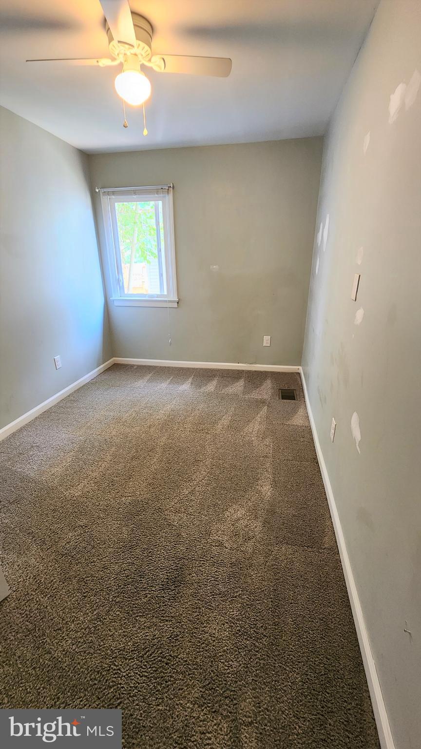 225 Deptford Road Glassboro, NJ 08028 - Photo 16 of 19 wooden floor in an empty room with a window