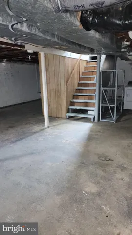 a view of an empty room with stairs