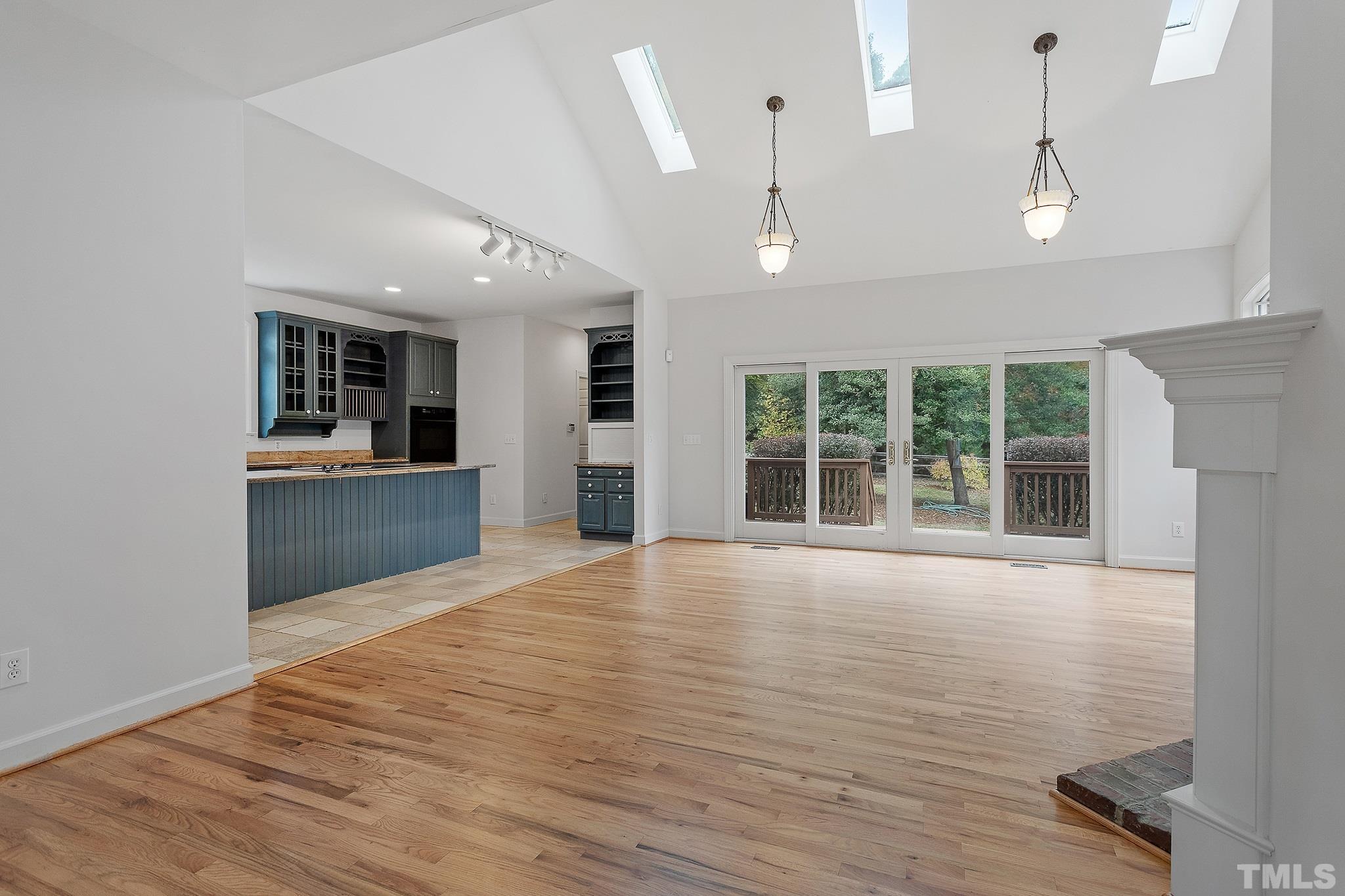 4025 Cuchalain Road Raleigh, NC 27616 - Photo 15 of 34 an empty room with wooden floor and windows