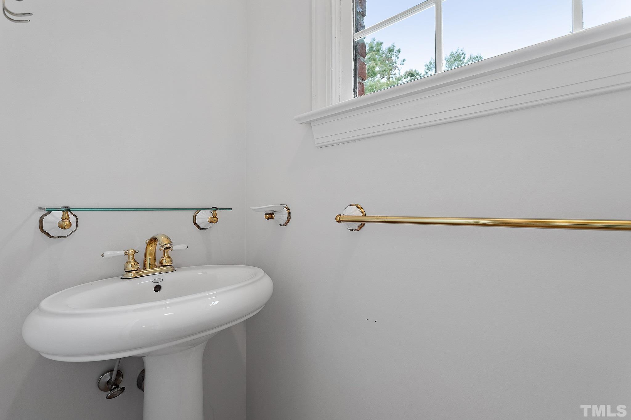 4025 Cuchalain Road Raleigh, NC 27616 - Photo 30 of 34 a bathroom with a sink and mirror