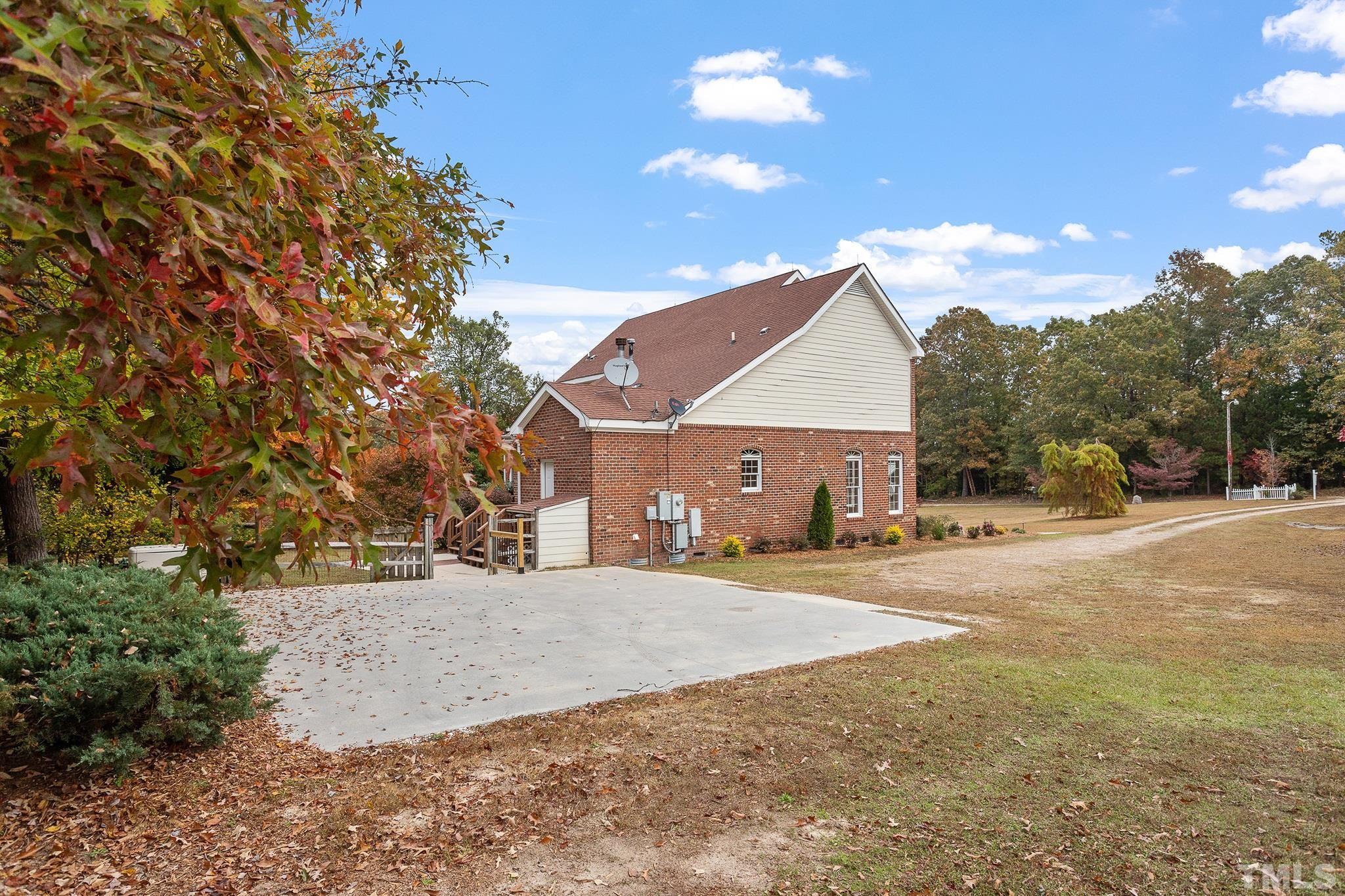4025 Cuchalain Road Raleigh, NC 27616 - Photo 4 of 34 a front view of a house with a yard and garage