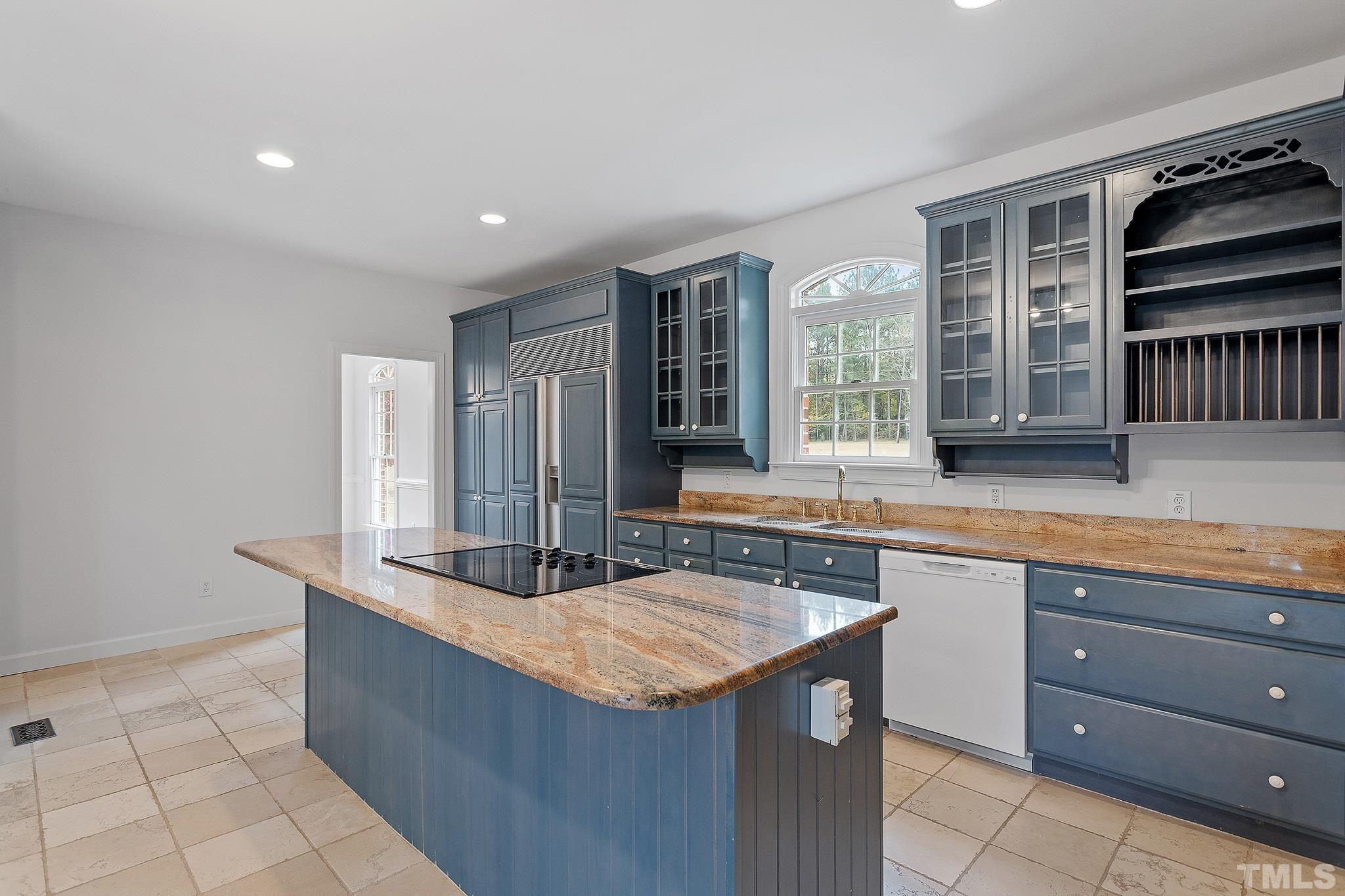 4025 Cuchalain Road Raleigh, NC 27616 - Photo 9 of 34 a kitchen with granite countertop a sink and a stove