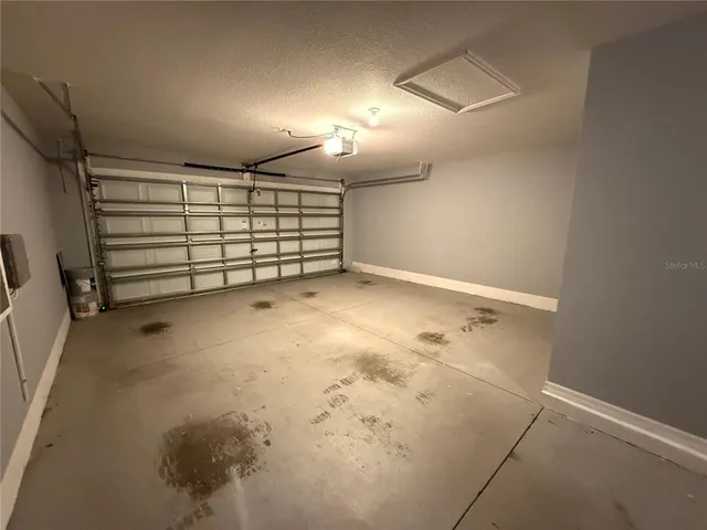 a bathroom with a window and a shower