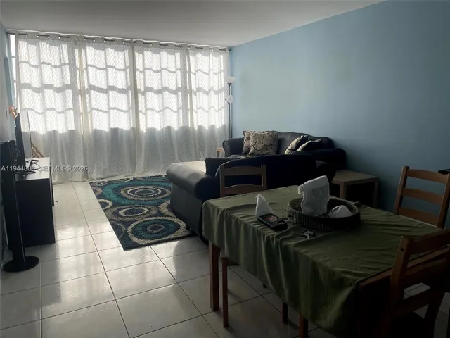 a bedroom with a bed and a table in it