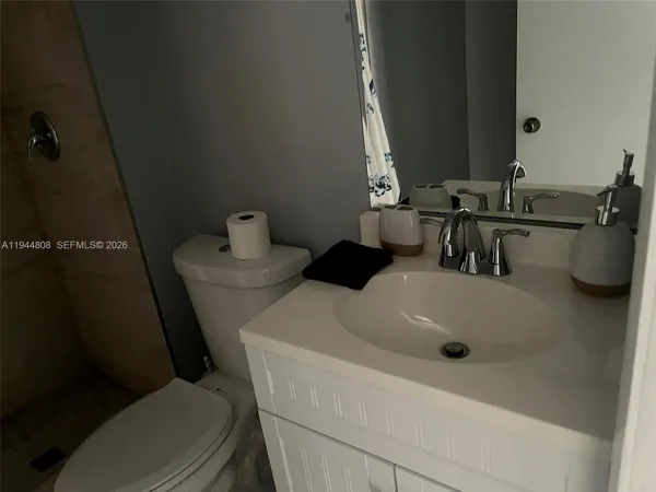 a bathroom with a sink and a toilet