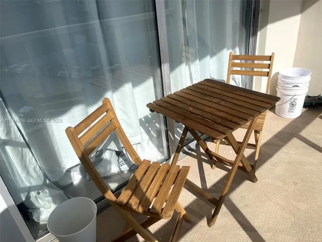 a view of a balcony dining area
