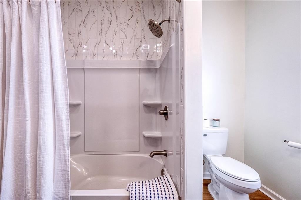 1415 Pacific Avenue Monaca, PA 15061 - Photo 22 of 39 a bathroom with a toilet and a shower curtain