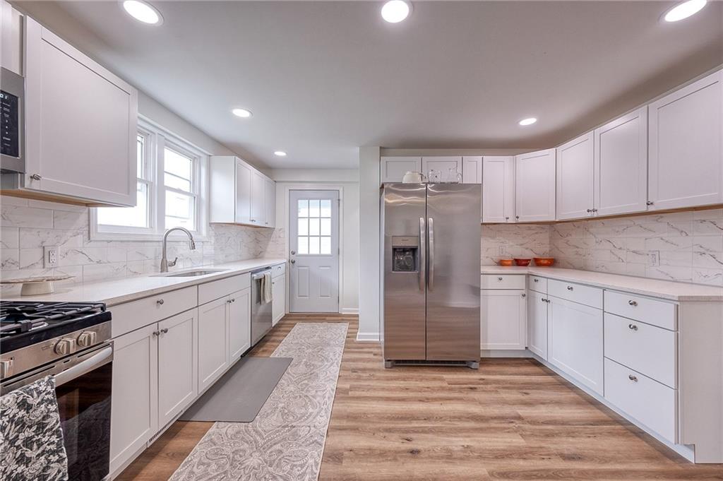 1415 Pacific Avenue Monaca, PA 15061 - Photo 24 of 39 a kitchen with a refrigerator sink and cabinets