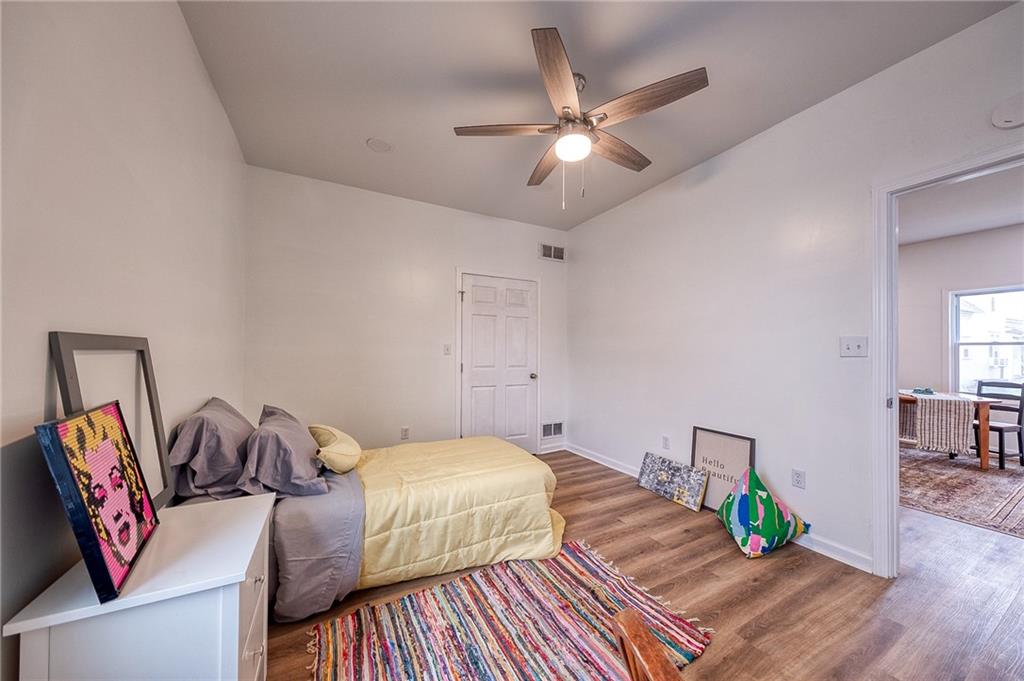 1415 Pacific Avenue Monaca, PA 15061 - Photo 29 of 39 a bedroom with bed and wooden floor