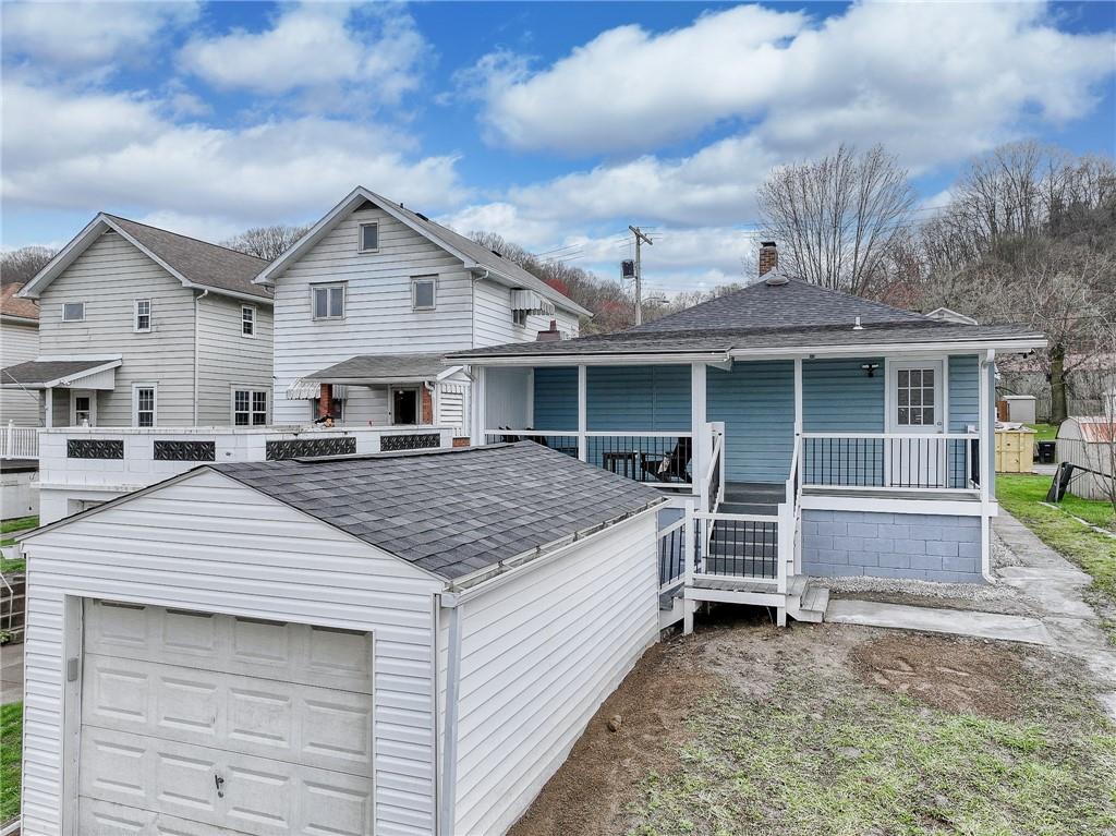 1415 Pacific Avenue Monaca, PA 15061 - Photo 3 of 39 a aerial view of a house with a yard and garage