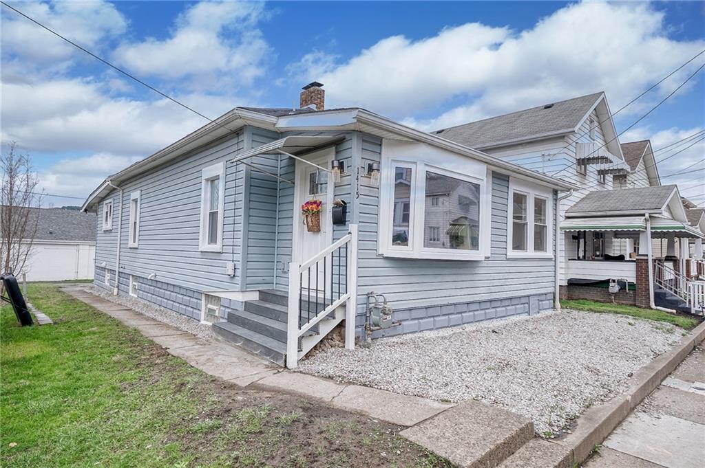 1415 Pacific Avenue Monaca, PA 15061 - Photo 39 of 39 a front view of a house with garden