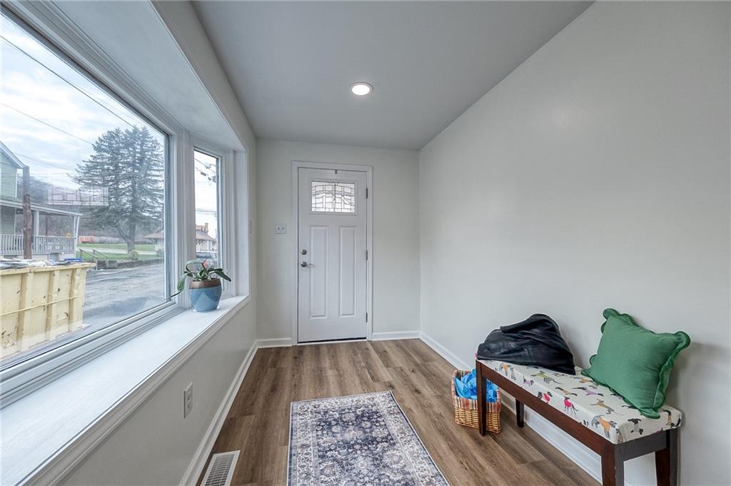 1415 Pacific Avenue Monaca, PA 15061 - Photo 4 of 39 a living room with furniture and a floor to ceiling window