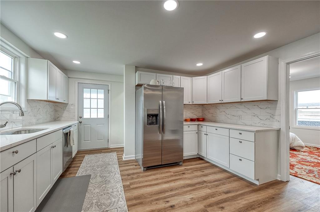 1415 Pacific Avenue Monaca, PA 15061 - Photo 9 of 39 a kitchen with a refrigerator sink and cabinets