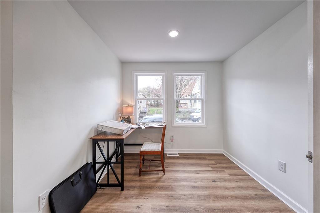 1415 Pacific Avenue Monaca, PA 15061 - Photo 10 of 39 a workspace with wooden floor and a window
