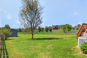 338 Pistole Road Sparta, TN 38583 - Photo 34 of 39 a garden with trees in front of it