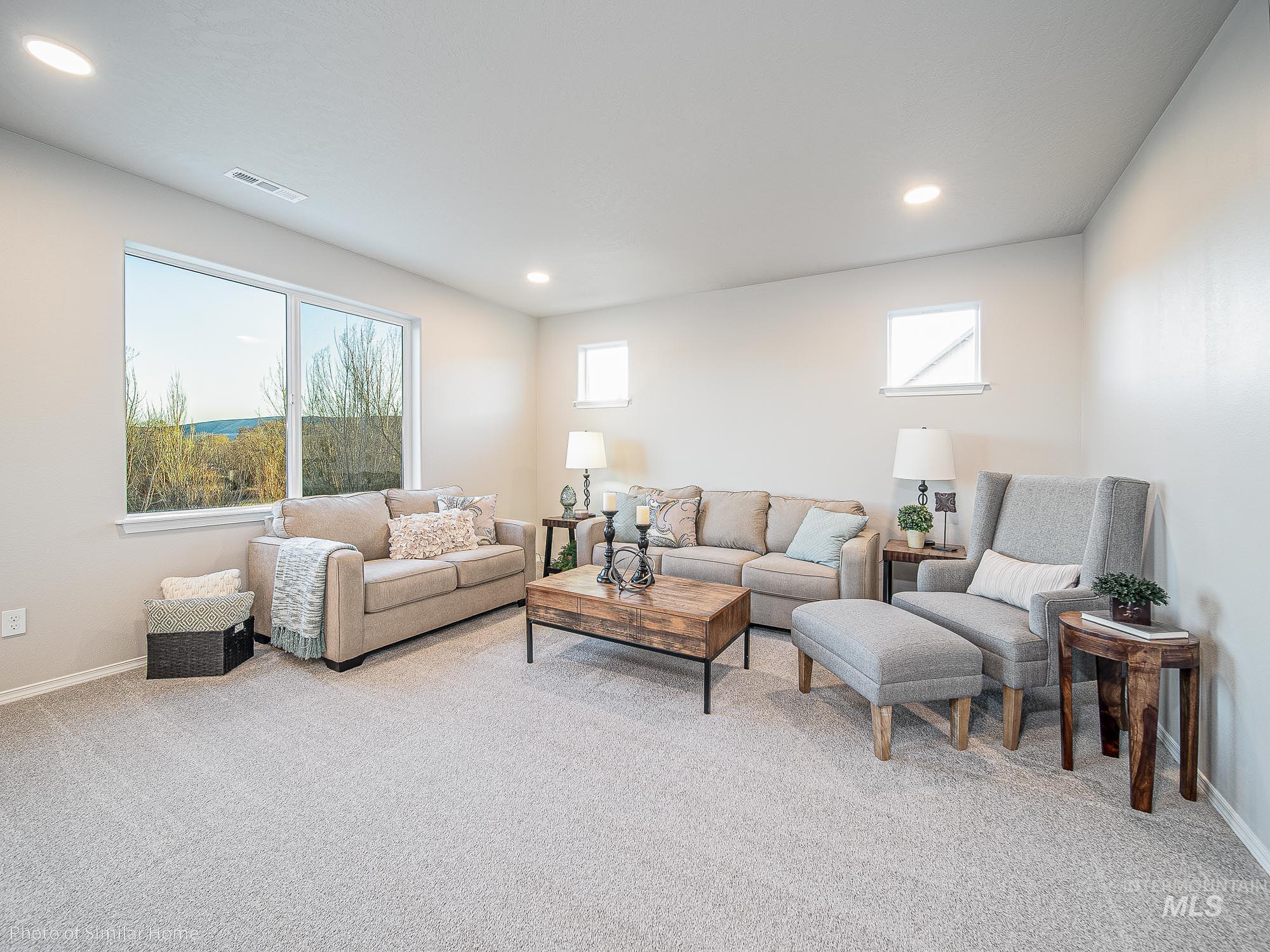 2049 Sumac Avenue Middleton, ID 83644 - Photo 5 of 6 Living room featuring light colored carpet, plenty of natural light, and recessed lighting