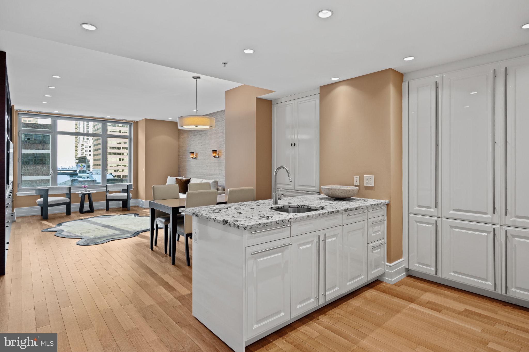 a kitchen with a sink stove and wooden cabinets