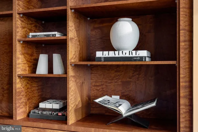 a living room with furniture and a mirror