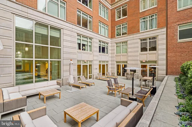 a view of a building with outdoor seating