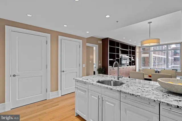 a kitchen with a sink and a refrigerator