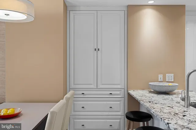 a view of room with furniture and wooden floor