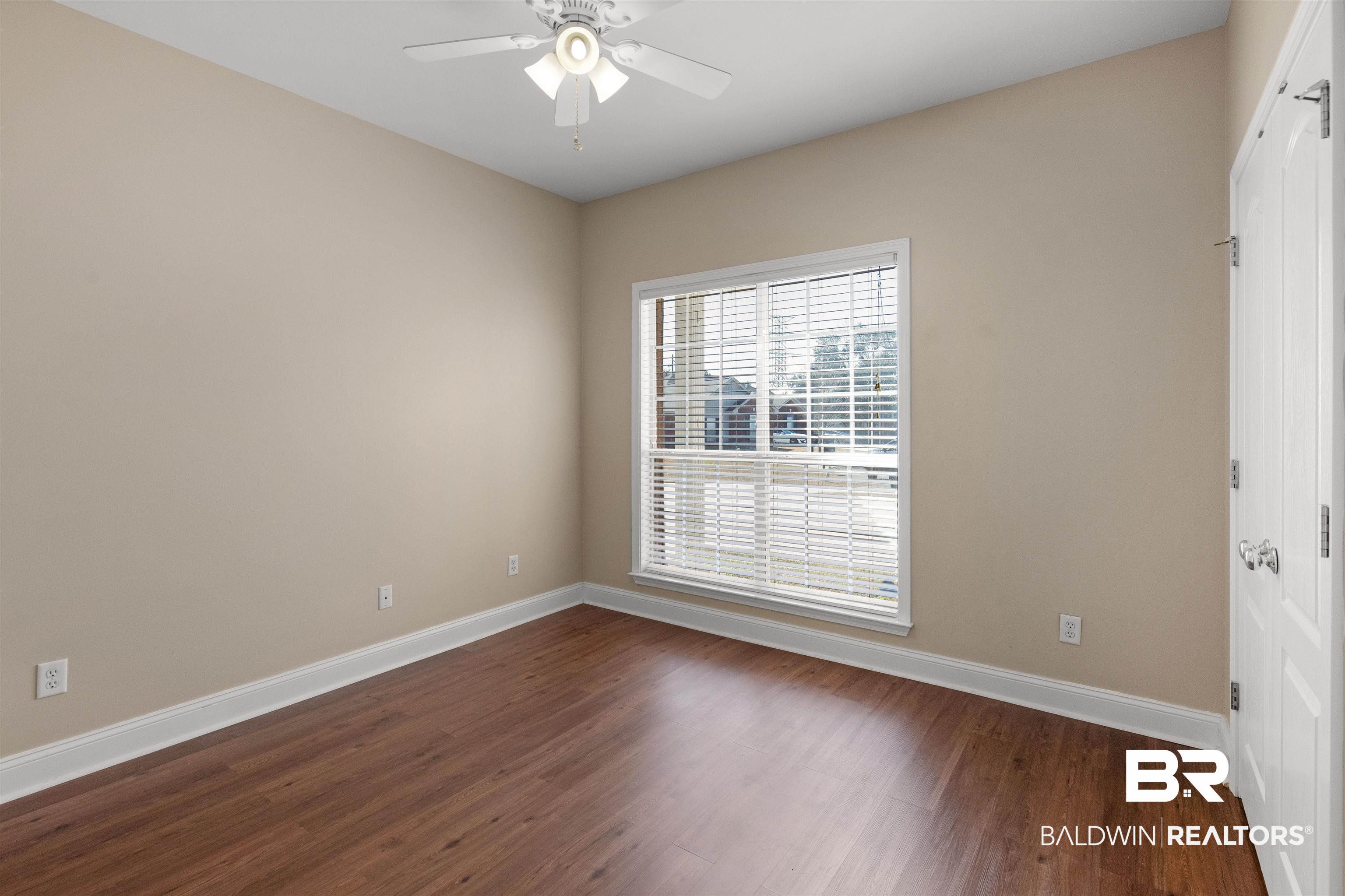 330 Allison Court Mobile, AL 36608 - Photo 16 of 27 Empty room with dark hardwood / wood-style flooring and ceiling fan