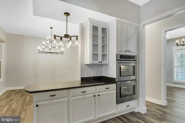a view of a balcony with wooden floor