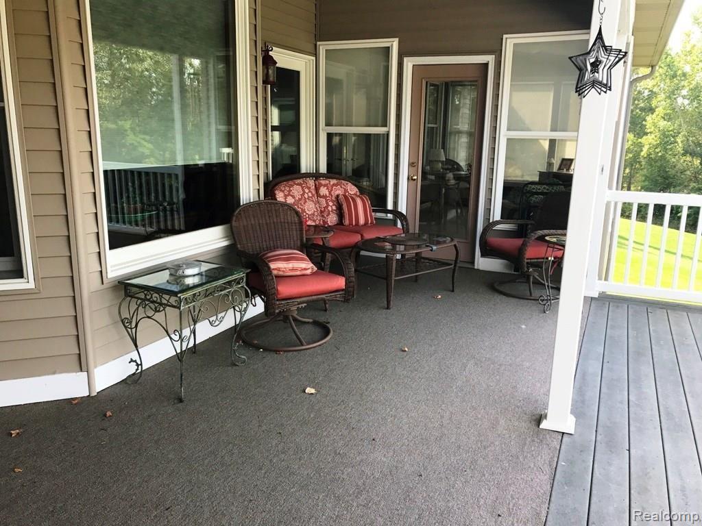 3335 North Cedar Road Fowlerville, MI 48836 - Photo 23 of 27 3335 Cedar - covered porch.jpg