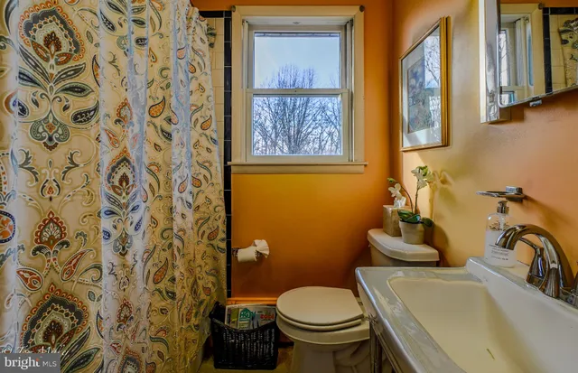 a bedroom with a bed and a mirror