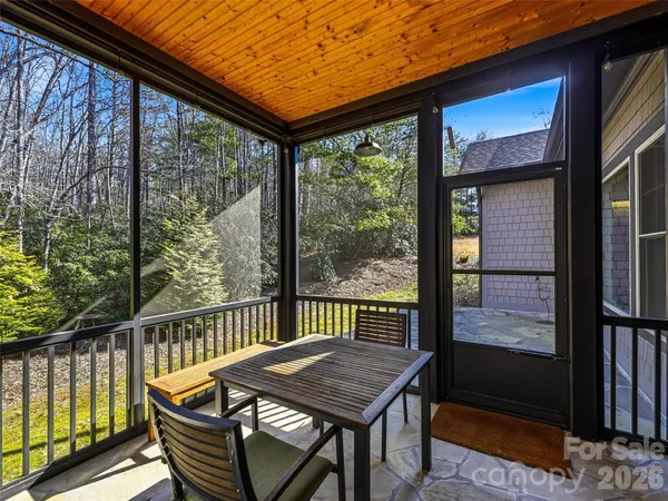 a view of a two chairs in the balcony