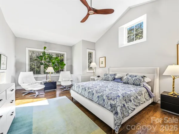 a bedroom with a bed and a couch