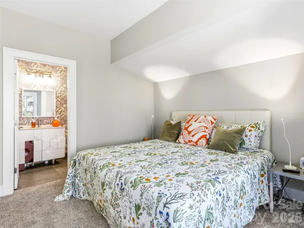 a bedroom with a bed and a couch