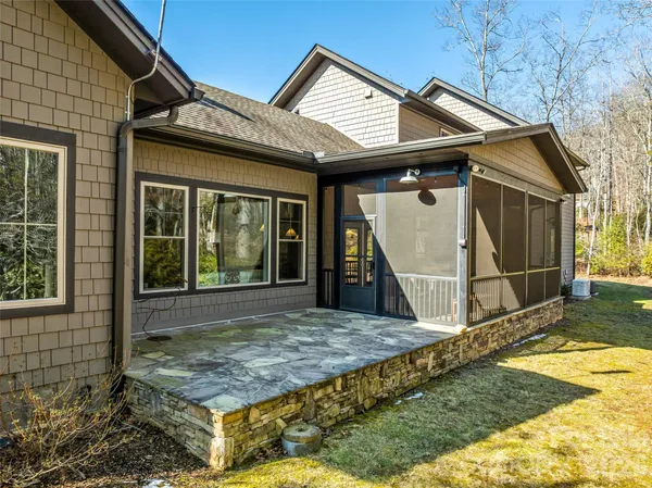 a aerial view of a house with a yard