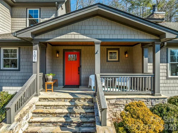 a front view of a house with large windows