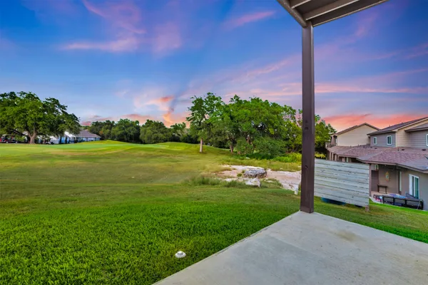 a view of yard and garage