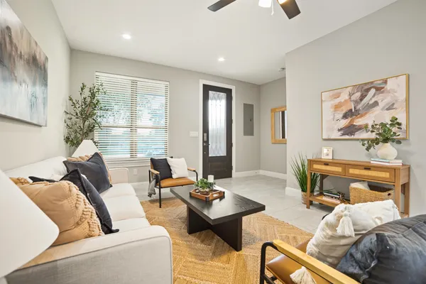 a living room with furniture and a large window